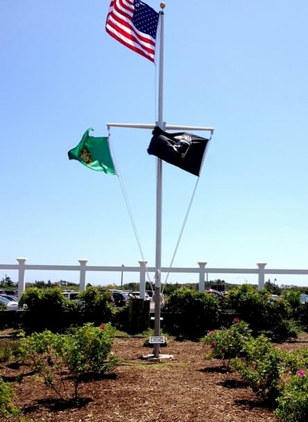 Customer photo, stake mount Eagle project plaque in front of flagpole.